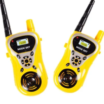 Green and yellow retail card packaging for a pair of KidzoSmile Walkie Talkies featuring a cartoon explorer illustration.
