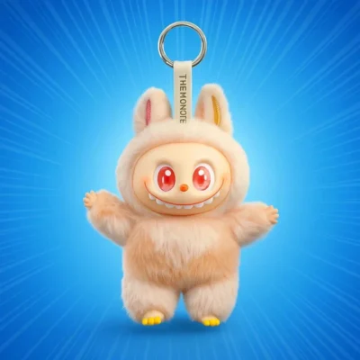 A beige, plush Labubu Monster collectible figure keychain featuring long serrated teeth, large red eyes, pointed ears, and a silver metal ring attachment against a radiating blue background.
