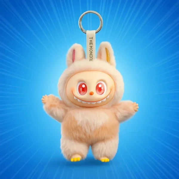 A beige, plush Labubu Monster collectible figure keychain featuring long serrated teeth, large red eyes, pointed ears, and a silver metal ring attachment against a radiating blue background.